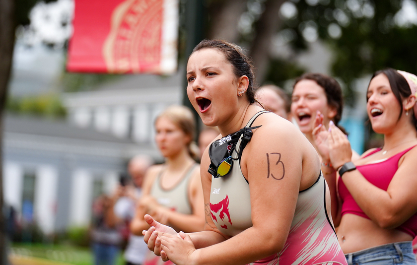 students cheer on the triathlon team