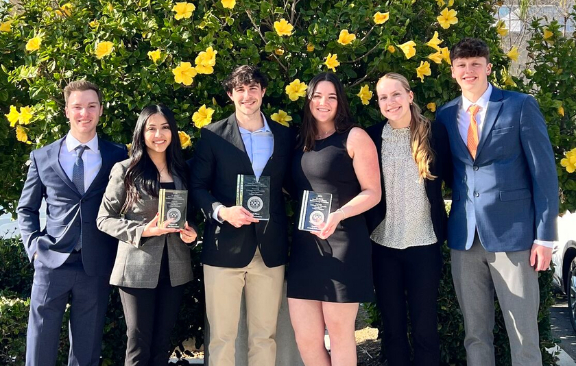 Students from business competition standing together