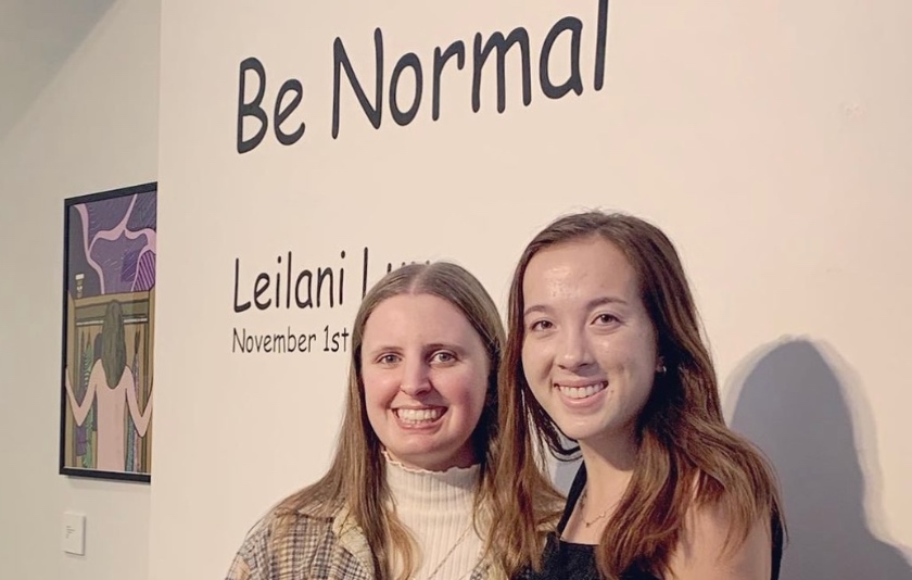 Leilani Luu stands in front of her exhibit entitled "Be Normal"