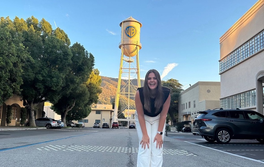 Gianna Marchese in front of the Warner Bros. symbol