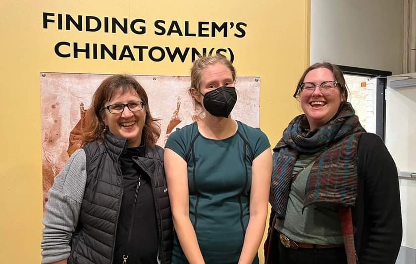 Straus stands with two collaborators in front of the exhibit "Finding Salem's Chinatown"