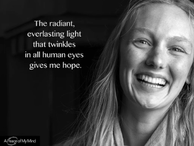 Photo of a face with the words "The radiant everlasting light that twinkles in all human eyes gives me hope."