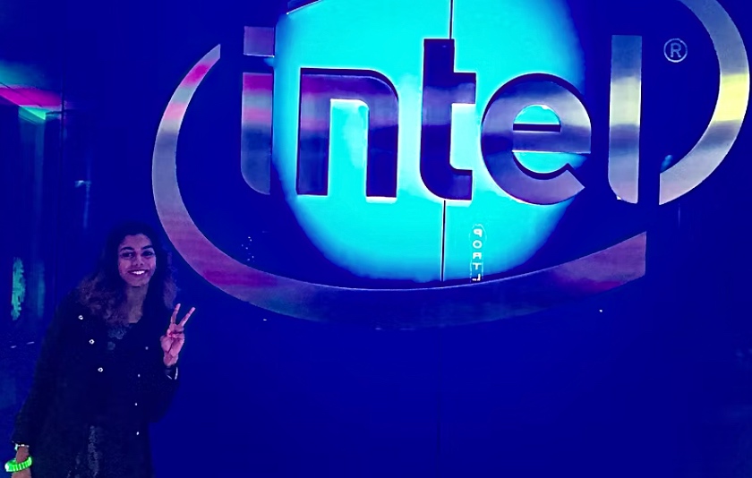 Wilson standing in front of "Intel" sign