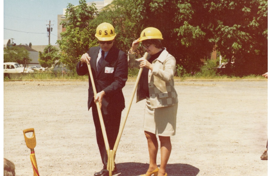 Two people with shovels