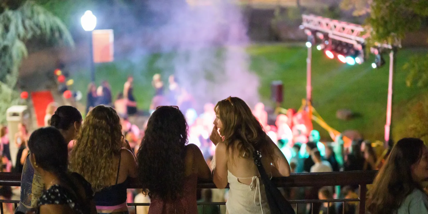 A group of students watching students dancing