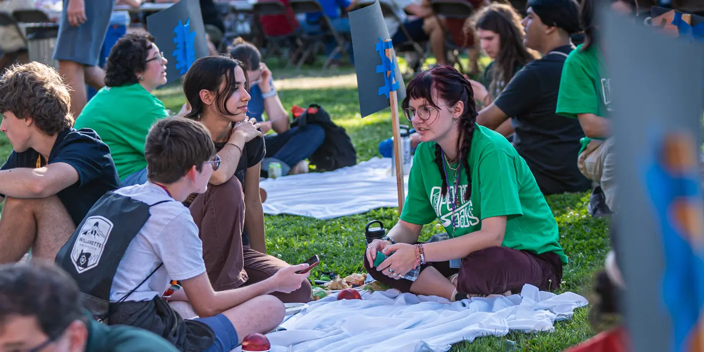 A group of students in the grass