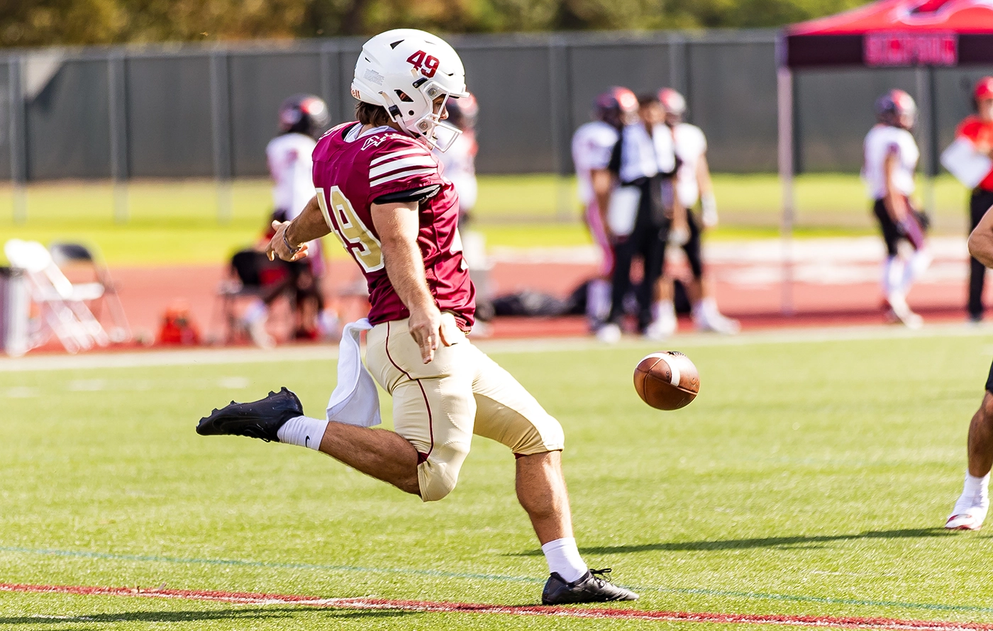 Willamette kicker kicking football