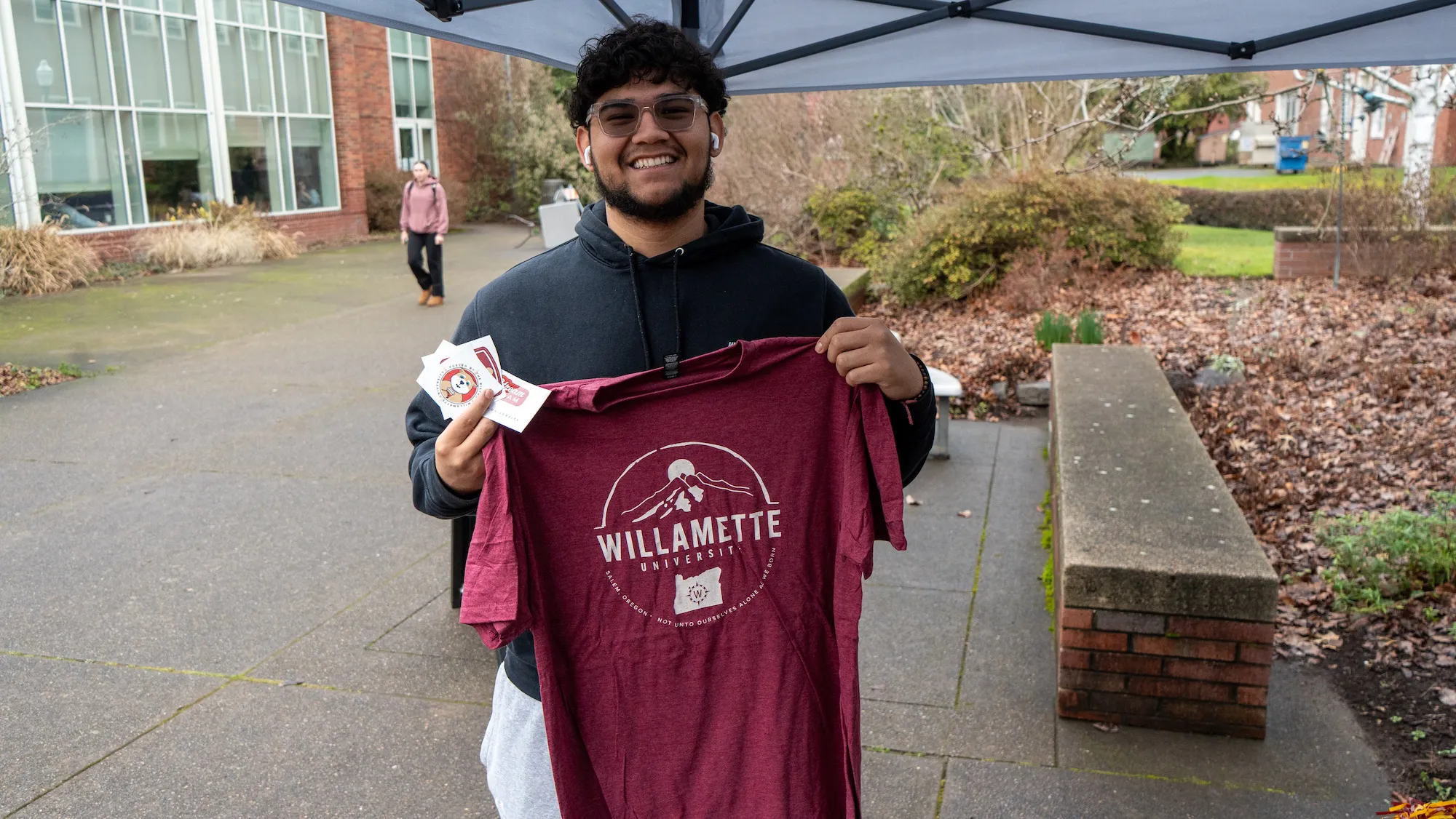 A student with a Willamette shirt