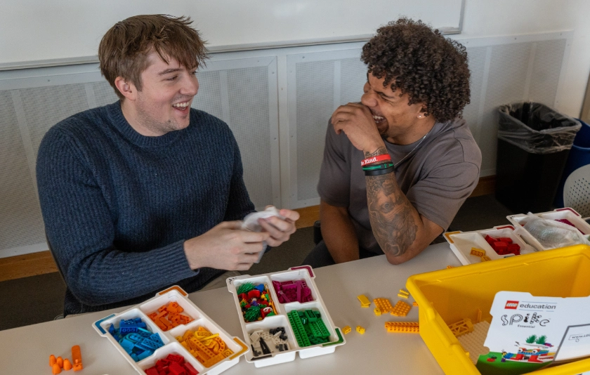 Two students with LEGO sets