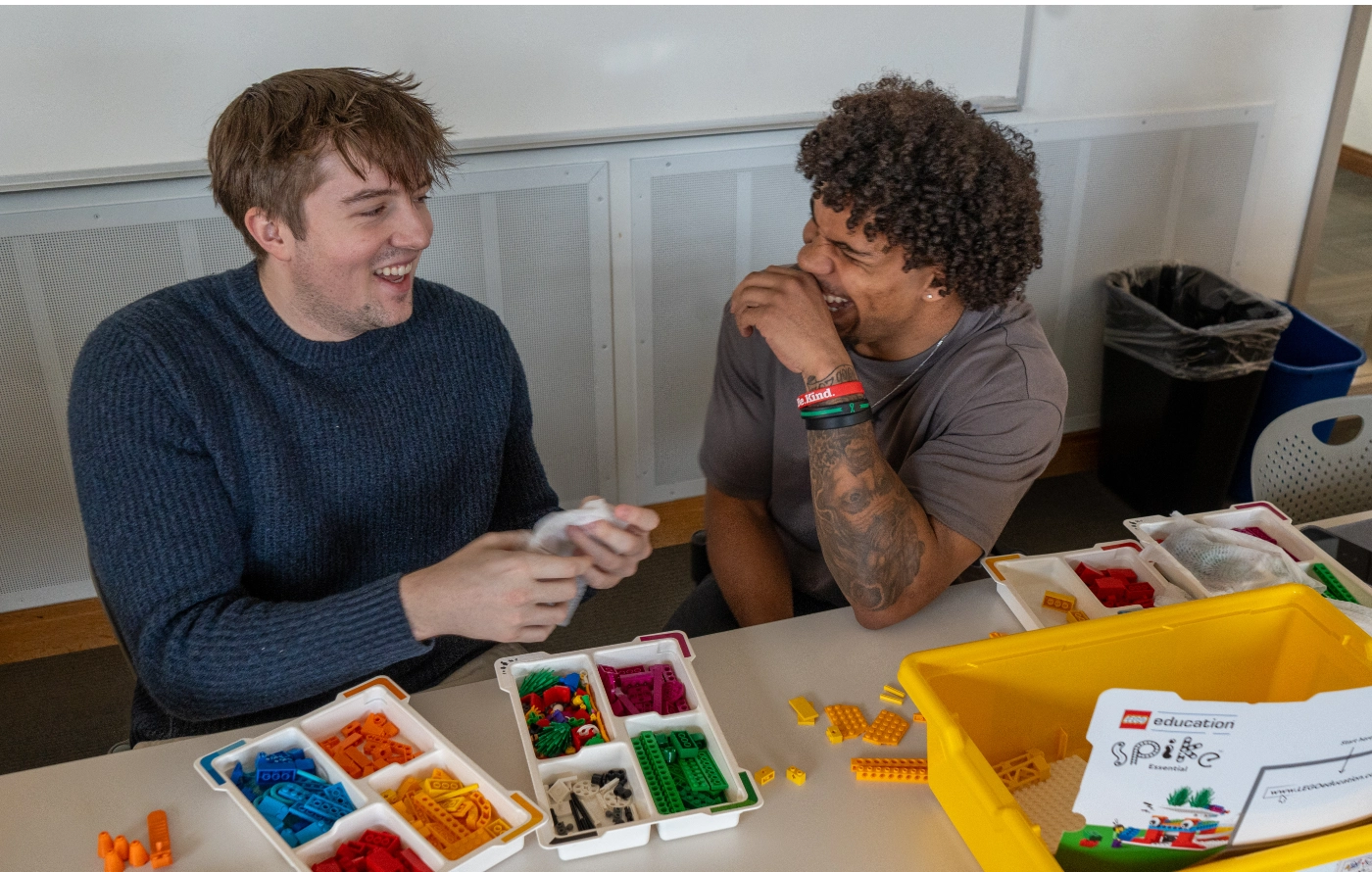 Two students with LEGO sets
