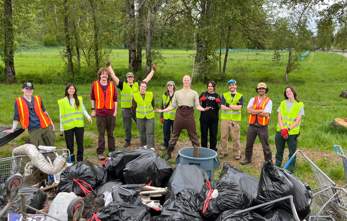 Students cleaning up trash in a park