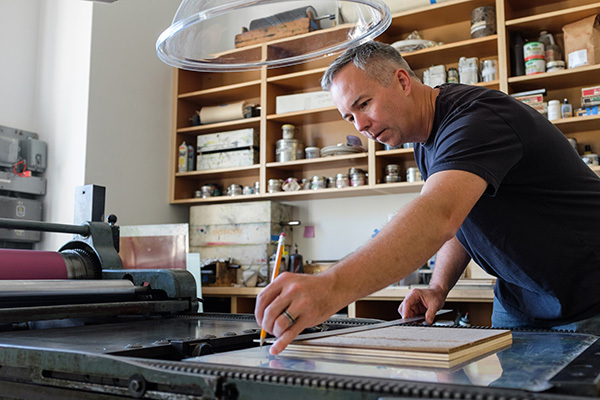 Matthew Letzelter in the print studio at PNCA, 2016. Photo: Mario Gallucci MFA '13