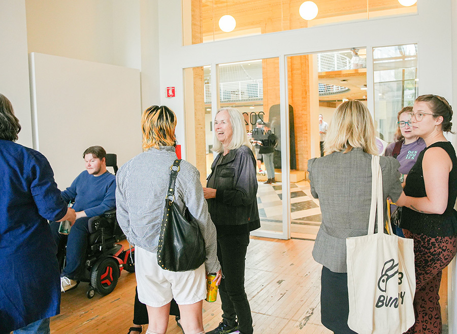 Visitors gathering at one of the galleries for the Low-Residency MFA in Visual Studies Open Studios