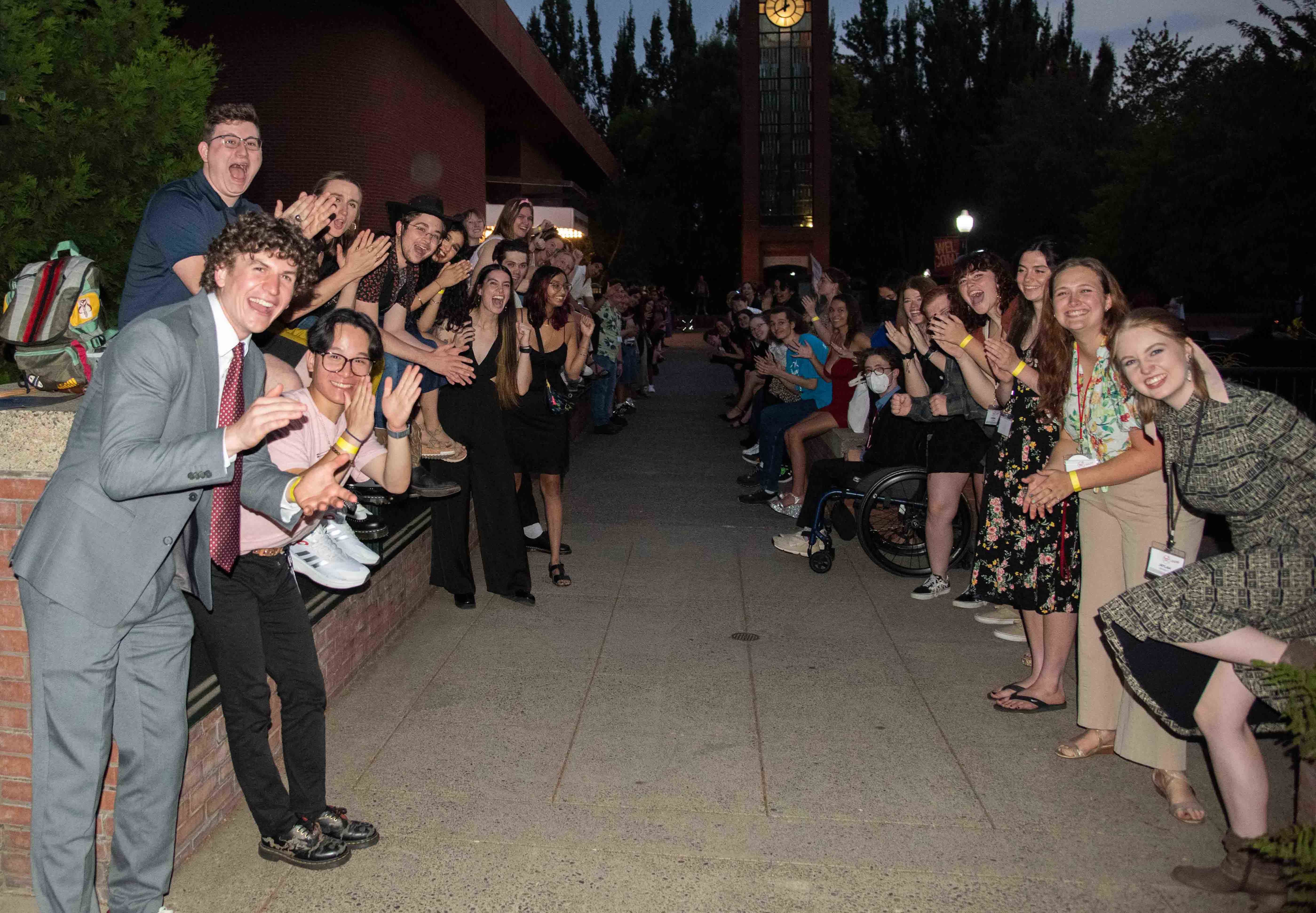 OD leaders, RAs and CAs form a welcome tunnel after Matriculation for new students.