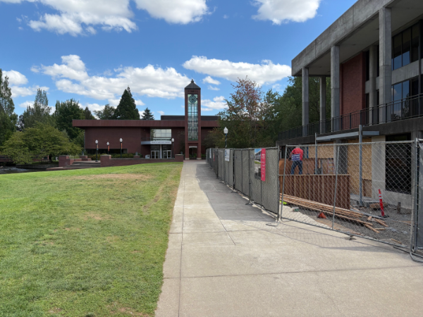 Putnam University sidewalk with fence.